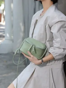 Minimalist light green genuine leather crossbody bag, stylish mini shoulder bag for women daily.