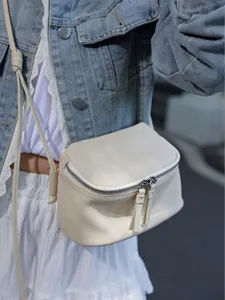 Mini leather crossbody bag for women, stylish minimalist shoulder box bag for daily travel use.