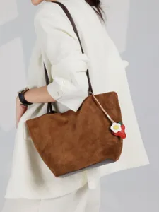 Brown suede shoulder bag for women, stylish tote bag with cute strawberry charm.