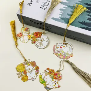 Exquisite metal cat bookmarks with gold tassels, cute floral design for book lovers.