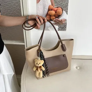 Sac cabas fourre-tout minimaliste et décontracté pour femme, élégant sac bandoulière chic.