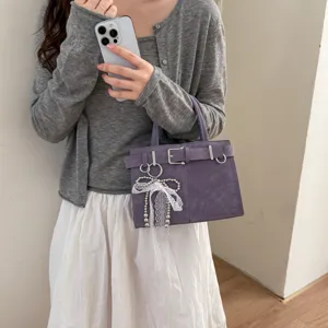 Vintage belt buckle decorative handbag for women, chic casual commuter crossbody shoulder bag.
