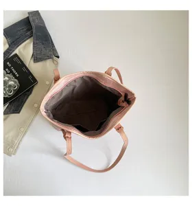 Detail view of the pink casual tote bag interior, showing large capacity and lining pockets.