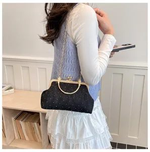 Vintage black kiss-lock evening bag with chain strap and metal handle for women