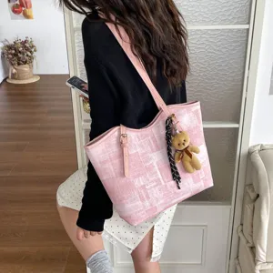 Pink tote bag for women, stylish large capacity shoulder bag for daily commuting and casual use.