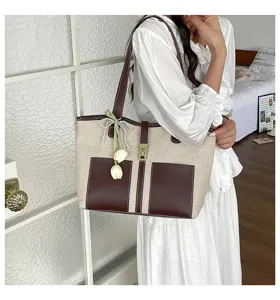 Commuting fashion canvas tote bag, large capacity shoulder bag with double front pockets.