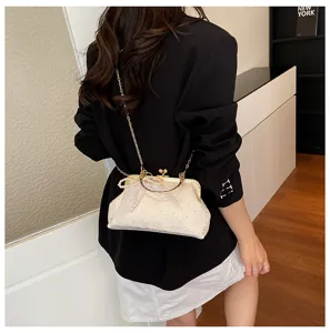 Vintage lace evening bag with pearl handle and gold chain strap for women elegant party.