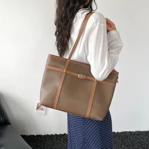 Retro textured large capacity shoulder handbag detail shot showing premium leather and design.