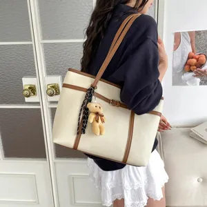 Retro textured large capacity tote bag with brown trim chic single shoulder handbag.