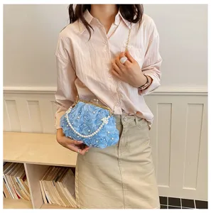 Floral evening clutch bag with pearl chain strap, elegant blue kiss-lock purse for women.