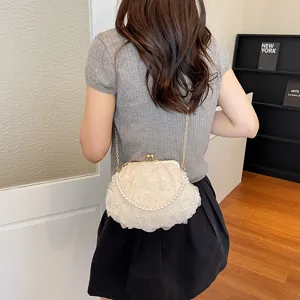 Elegant pearl chain evening bag with floral design, chic kiss-lock clutch for women parties.