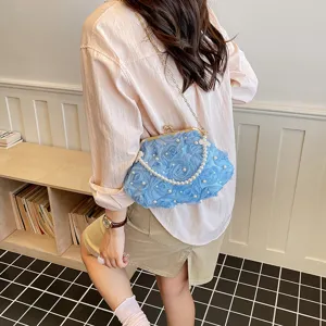 Elegant blue floral clutch bag with pearl chain strap, stylish women evening shoulder bag view.