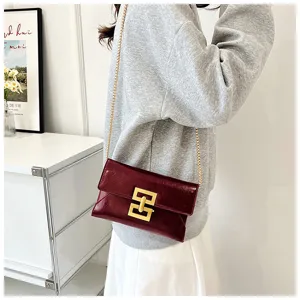 Wine red patent leather chain crossbody bag for women, stylish minimalist shoulder bag.