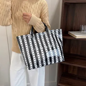 Black and white striped bow tote bag, large capacity casual shoulder bag for daily commuting.