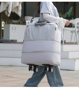 Vue détaillée du sac de voyage à roulettes extensible et portable avec roues et poignées.