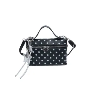 Black white polka dot box bag with top handle, crossbody strap, and silver star charm daily use