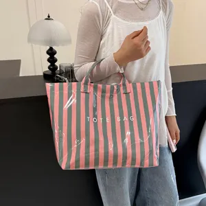 Close-up view of the striped PVC tote bag showcasing its spacious interior and vibrant color.