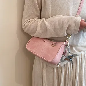 Chic pink shoulder bag for women, trendy solid color crossbody purse with stylish star charm.