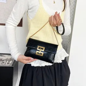 Chic black leather chain crossbody bag for women, stylish shoulder bag with gold metal lock.