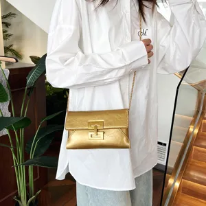 Minimalist gold chain cross-body bag for women, stylish metallic shoulder handbag new.