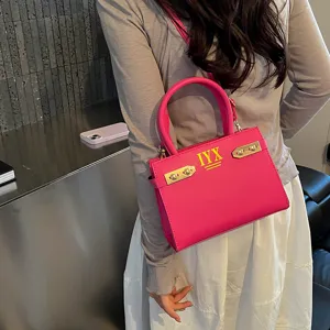 Pink stylish women handbag with metal buckle and top handle, trendy fashion shoulder bag for daily.