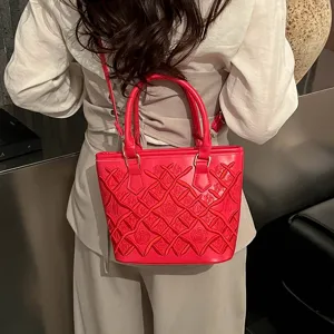 Red leather bucket bag with quilted embroidered pattern, elegant French style shoulder bag.
