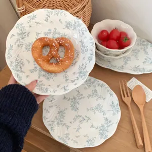 French retro ceramic dinner plate with mist blue floral embossed design for elegant dessert serving.