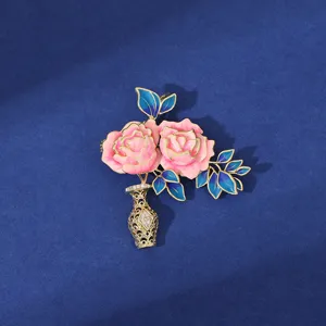 Exquisite peony vase brooch with vibrant enamel colors and glittering rhinestones for elegant styling.