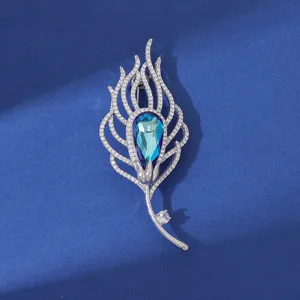 Elegant zircon feather brooch featuring a blue crystal teardrop, perfect for coats and suits.