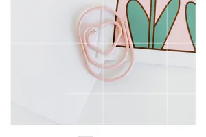 Mini pink heart paper clips, cute shaped PET plastic coated clips for office and school stationery.