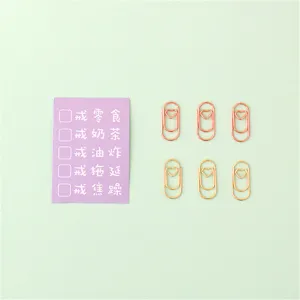 Jolis petits trombones en forme de cœur en or rose, parfaits pour classer vos documents.