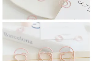 Pink heart shaped paper clips detail shot, cute mini metal stationery clips for daily use