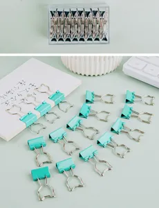 Cute cat shaped metal binder clips in mint green, perfect for office and school stationery.