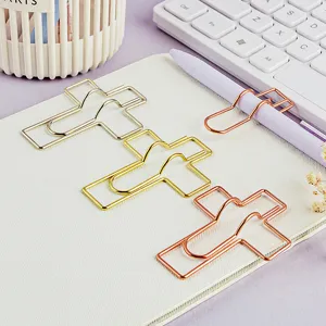Metal cross paper clips and pen holders set, creative stationery for notebook and planner use.