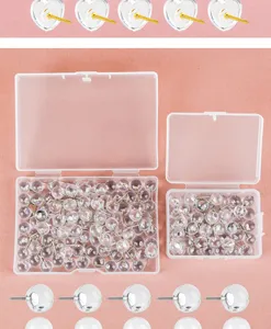 Clear push pins detail showing transparent ball and heart thumbtacks in plastic storage boxes.