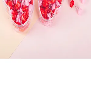 Heart shaped push pins decorative cute pink red thumb tacks in clear plastic box detail view