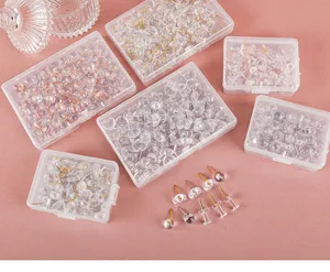 Clear push pins set in storage boxes, transparent decorative thumb tacks for cork board office.