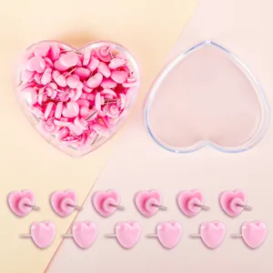 Cute pink heart-shaped pushpins with clear heart storage box, ideal for photo wall and cork board.