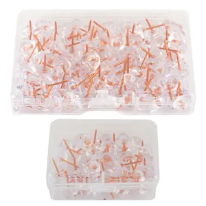 Transparent push pins thumb tacks with copper needles in clear storage boxes for cork boards.