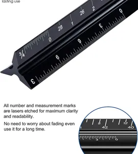 Detail shot of black aluminum architectural scale ruler with precise laser-etched measurements.