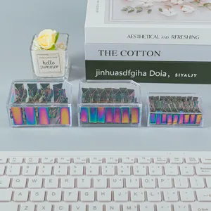 Colorful metal binder clips in clear acrylic boxes, perfect office stationery for organizing.
