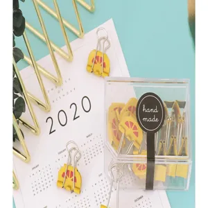 Cute yellow fruit binder clips detail, creative metal stationery paper clamp in clear box.