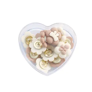 Cute flower and bow pushpins in a heart box for cork board and photo wall decoration.