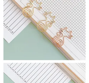 Cute gold cat shaped metal paper clips for daily planner stationery and cute office desk use.