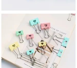 Colorful metal binder clips with cute hollow heart design, perfect for office and school.