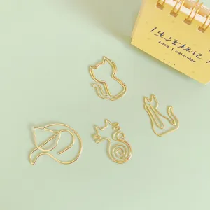 Cute gold metal cat paper clips set, creative stationery for office and school use.