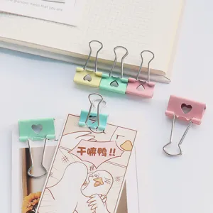 Colorful metal binder clips with heart hollow design, cute pastel office stationery clamp.