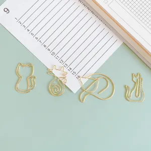 Cute gold metal cat paper clips set, various creative shapes, fun bookmarks for office stationery.