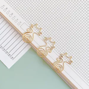 Cute gold cat shaped paper clips metal bookmarks for office and school stationery use.