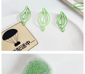 Green leaf-shaped paper clips metal plastic coated cute bookmarks for office stationery desk use.